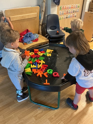 Preschool children engaging in Tuff Tray