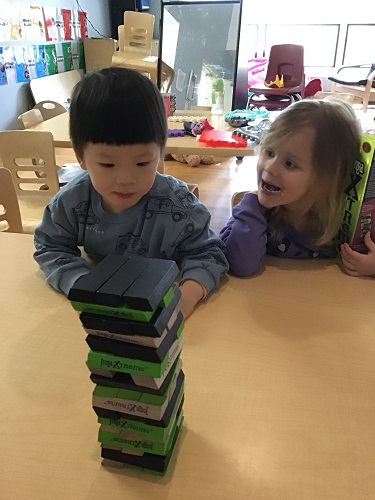 children observing a tower