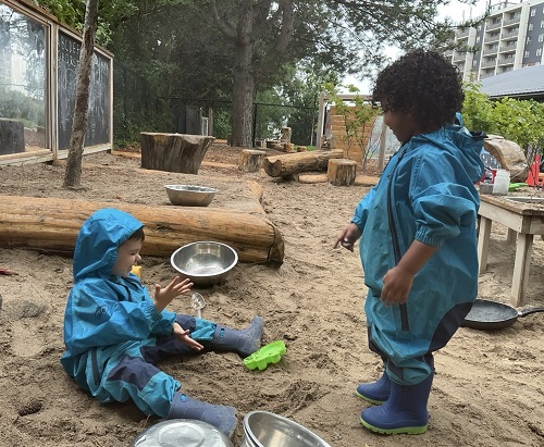 children playing in the sand