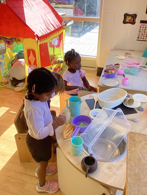 children playing in kitchen area