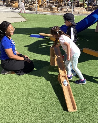 children build ramps with an educator